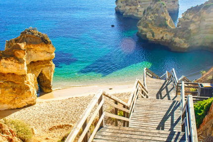 Beach views with wooden staircase to Praia do Camilo