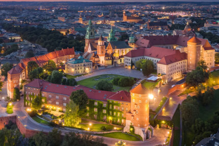 Krakow, Poland. Aerial view of illuminated Wawel Royal Castle on sunset