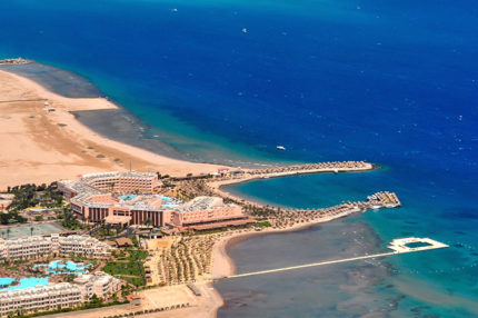 Aerial view of green water and bungalows, Bora Bora.