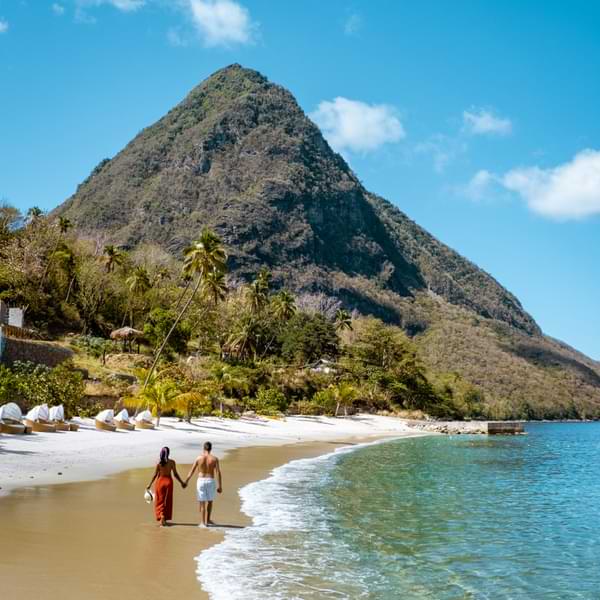 couple walking on beach in saint lucia